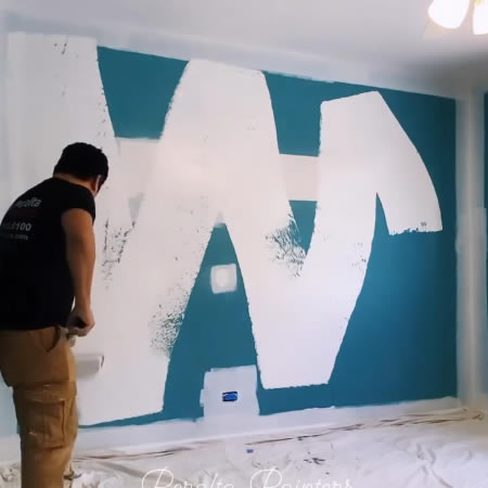 Professional painter interior painting on a wall in north shore il